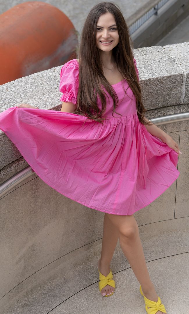 pink gathered dress Long gathered dress with a pink choker neckline